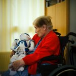 Zora, the Robot caregiver in the embrace of the a senior patient